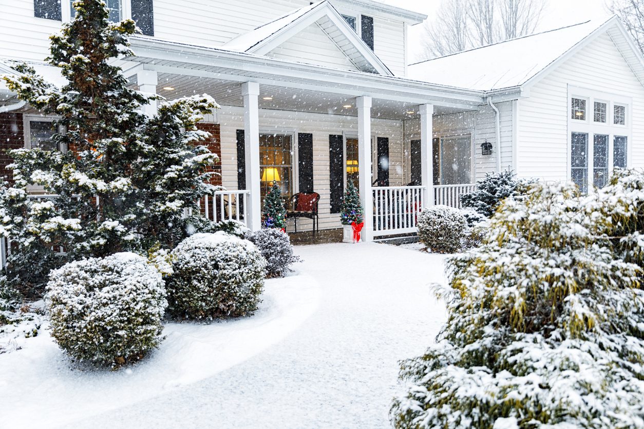 Long Island home in winter snow kept warm by scheduled heating oil delivery